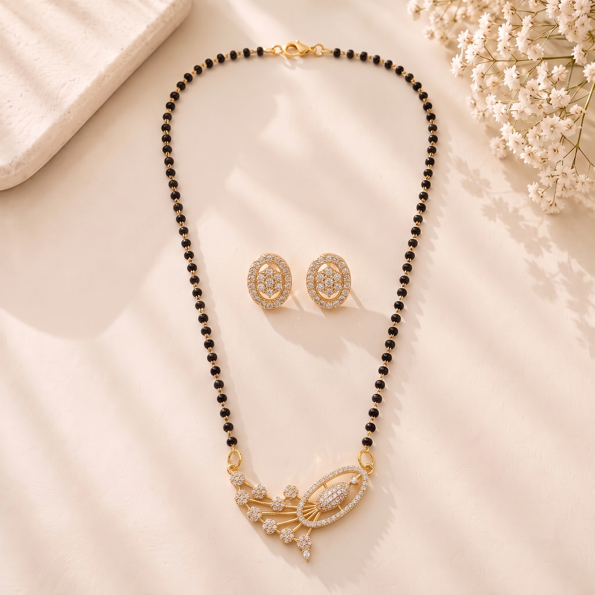 Mangamta Asymmetric Fan Motif Stone Mangalsutra Set with Oval Stud Earrings