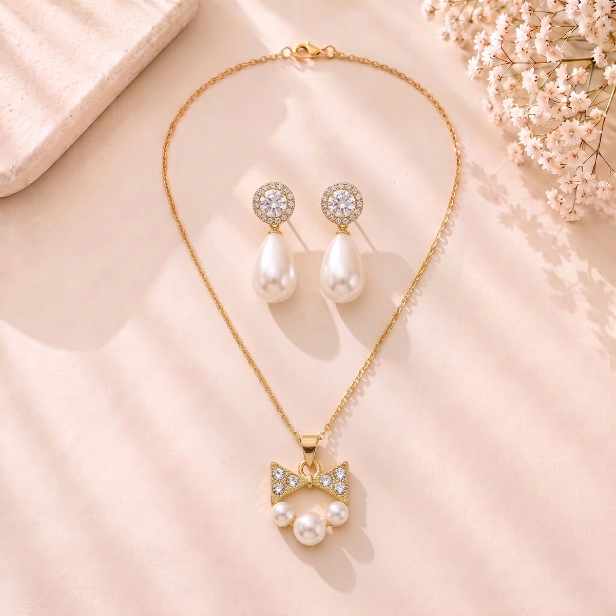 Mangamta Sparkling Bow & Pearl Cluster Necklace Set with Teardrop Pearl Earrings
