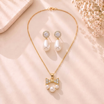 Mangamta Sparkling Bow & Pearl Cluster Necklace Set with Teardrop Pearl Earrings